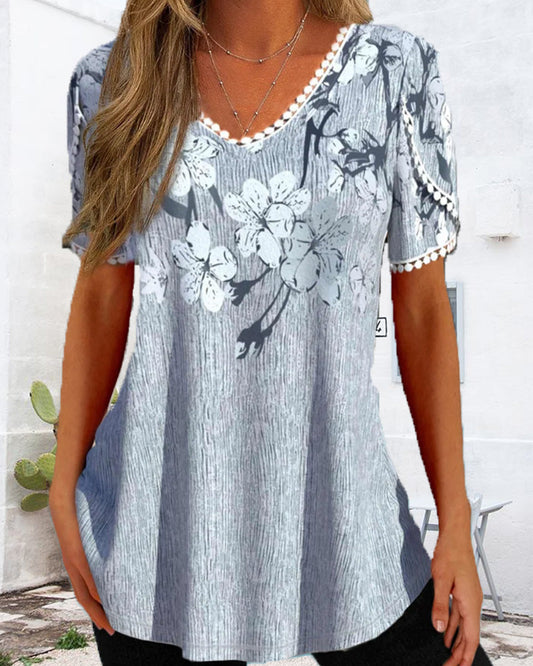 Elegant bluse med blomsterprint og korte ærmer